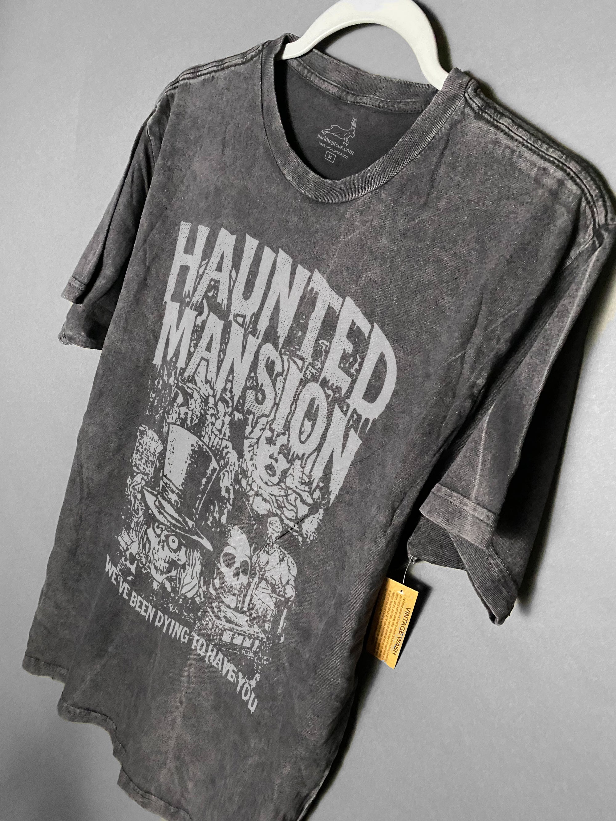 We designed this one of a kind tee Haunted Mansion tee only available at Park Hop Tees. This is made with the hatbox ghost, and madame leotta. We've been dying to have you